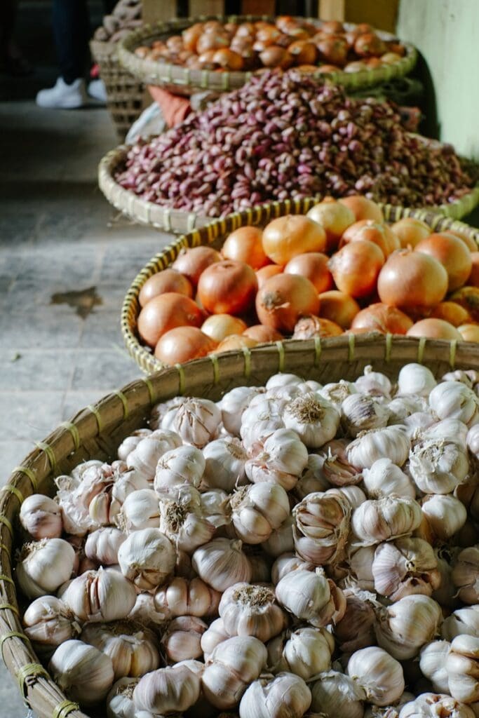 orange and red tomatoes on brown woven basket